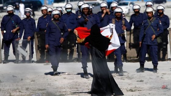 Bahraini mother stands against the Al-Khalifa regime's police.